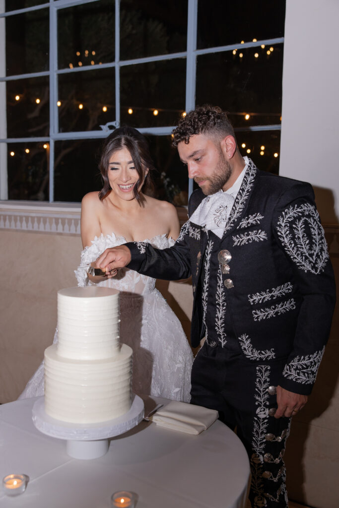 Grand Gimeno wedding bride and groom cake cutting.