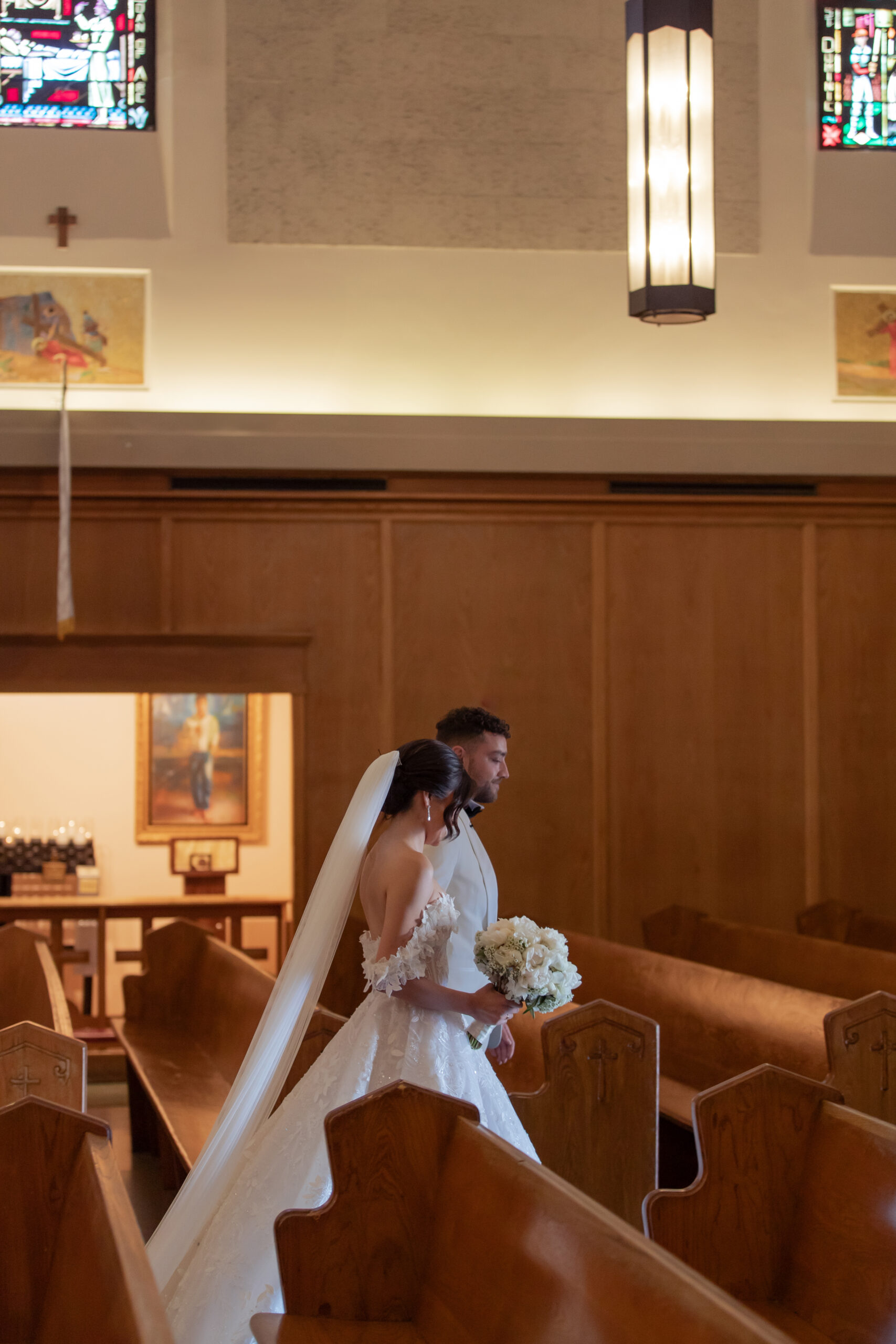 Bride and groom recessional at Saint Emydius church in Los Angeles.