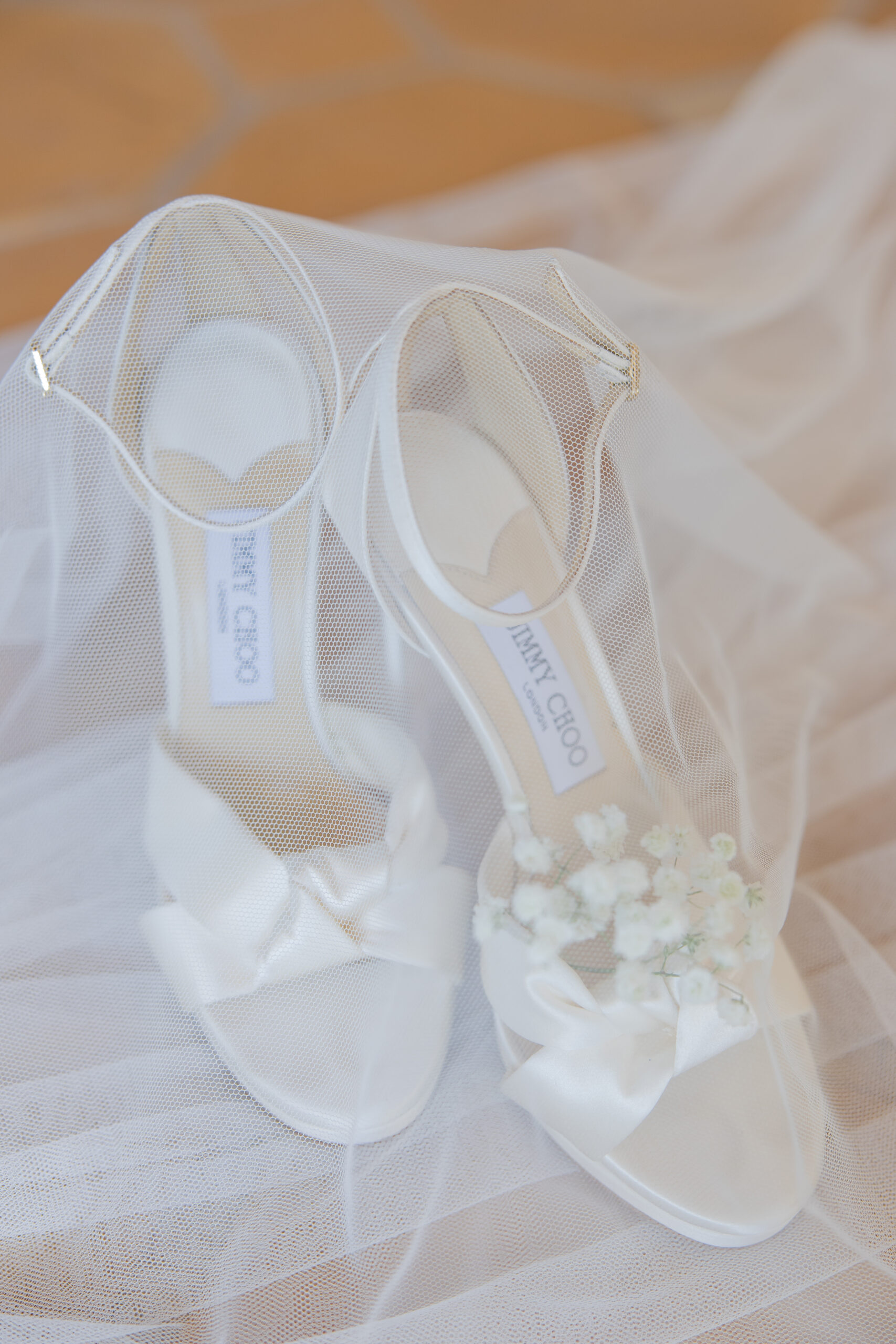 Jimmy Choo bridal shoe flat lay.
