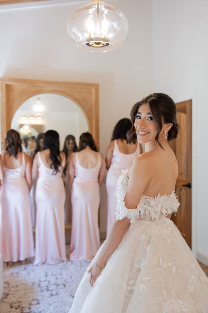 Bride first look with her bridesmaids in the Grand Gimeno bridal suite.
