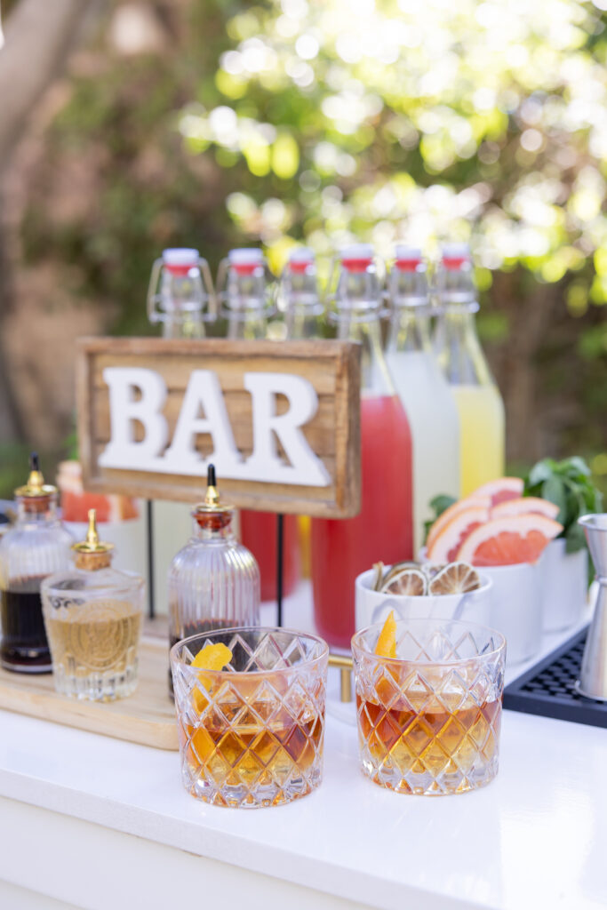 Wedding bar display with two drinks in glasses. 