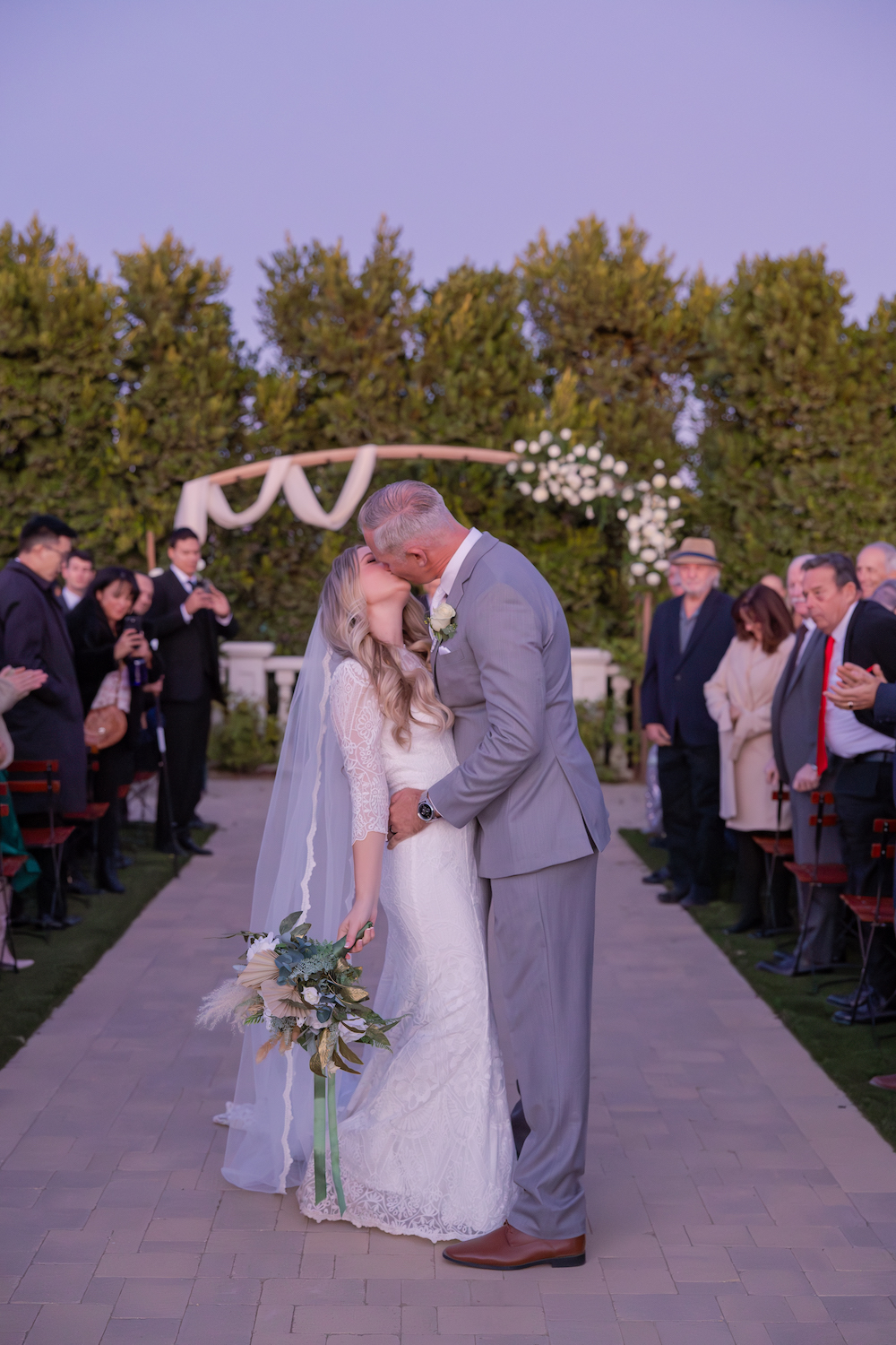 Bride and groom recessional kiss. 